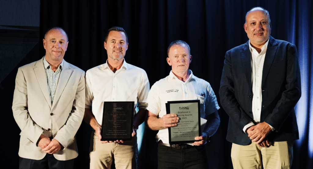 Chris the Director of Invercargill and Winton Flooring Xtra standing with presenters of the FloorNZ Excellence Awards receiving the supreme award